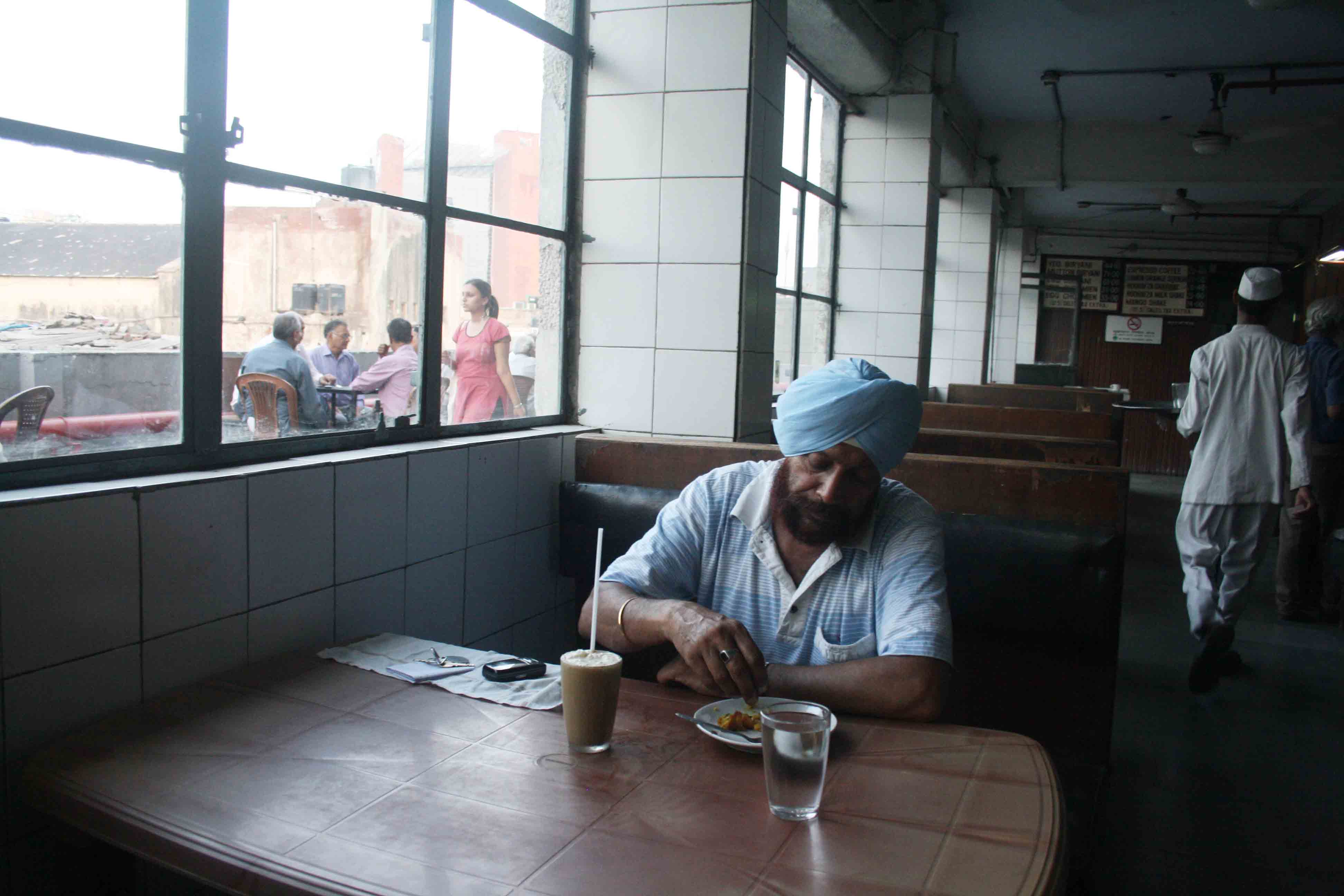 Photo Essay – The Aloofness of a Man in the Indian Coffee House